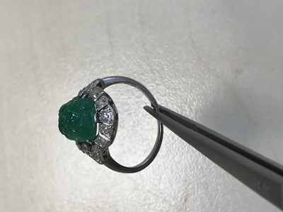 Lot 1373 - CARVED EMERALD AND DIAMOND RING