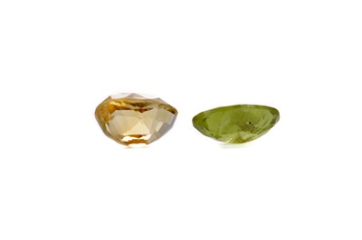 Lot 1462 - A CERTIFICATED UNMOUNTED CITRINE AND PERIDOT