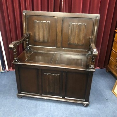 Lot 133 - A REPRODUCTION MONKS BENCH