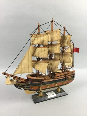 Lot 242 - A WOOD MODEL OF H.M.S BOUNTY, FOUR FIGURES AND FOUR CERAMIC PLATES