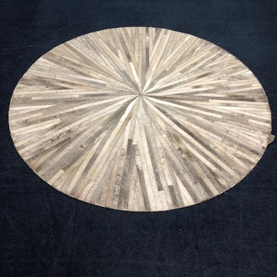 Lot 268 - A COWHIDE CIRCULAR RUG