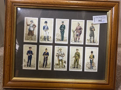 Lot 382 - A FRAMED SET OF PLAYERS CIGARETTE CARDS AND PRINTS