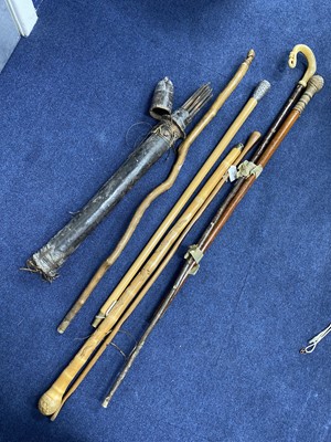 Lot 461 - A LOT OF WALKING STICKS AND A QUIVER OF ARROWS