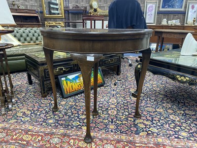 Lot 471 - A REPRODUCTION MAHOGANY DEMI-LUNE TURNOVER TEA TABLE