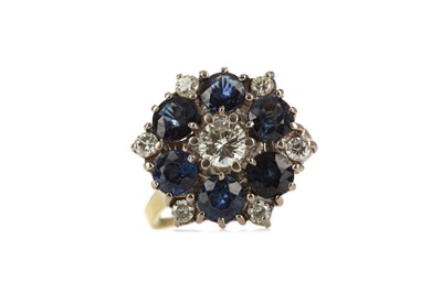 Lot 311 - A BLUE GEM SET AND DIAMOND CLUSTER RING