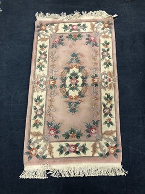 Lot 153 - A 20TH CENTURY CHINESE FRINGED RUG AND TWO OTHER RUGS