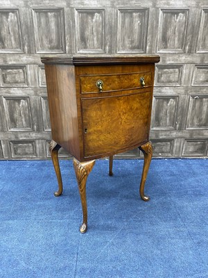 Lot 160 - A BURR WALNUT BOW FRONTED CUPBOARD CHEST