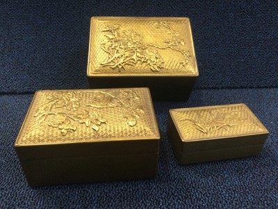 Lot 729 - A 20TH CENTURY SET OF THREE JAPANESE GILT LACQUERED BOXES AND A WHITE METAL BOX