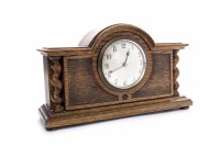 Lot 7 - OAK MANTEL CLOCK The French brass movement...