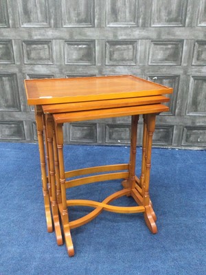 Lot 208 - A YEW WOOD NEST OF THREE TEA TABLES