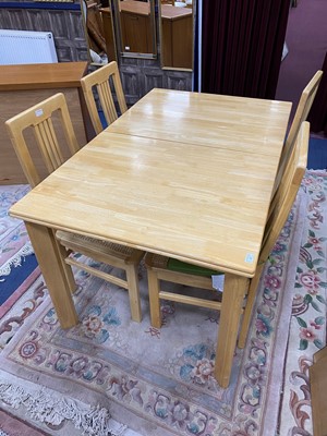 Lot 217 - A MODERN PULL OUT DINING TABLE AND FOUR CHAIRS