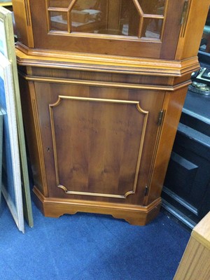 Lot 202 - A REPRODUCTION YEW WOOD CORNER CABINET