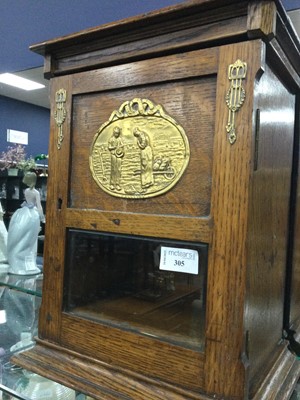 Lot 305 - AN EARLY 20TH CENTURY OAK SMOKER'S CABINET