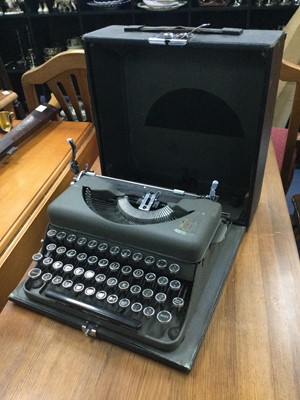 Lot 319 - A PORTABLE TYPEWRITER, WALL MIRROR AND LEATHER SUITCASE