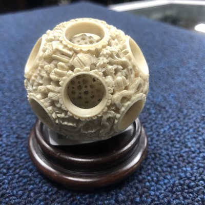 Lot 17 - AN EARLY 20TH CENTURY CHINESE CARVED IVORY CONCENTRIC BALL