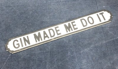 Lot 404 - GIN MADE ME DO IT, A PAINTED WOOD STREET SIGN STYLE PLAQUE