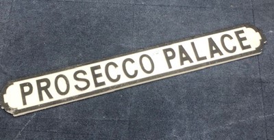 Lot 405 - PROSECCO PALACE, A PAINTED WOOD STREET SIGN STYLE PLAQUE