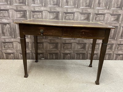 Lot 389 - AN OAK LEATHER TOPPED DESK