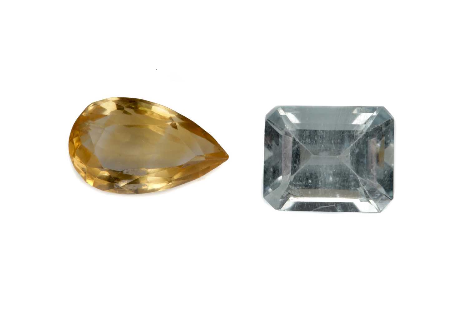 Lot 437 - A CERTIFICATED UNMOUNTED CITRINE AND AQUAMARINE