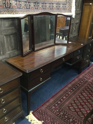 Lot 440 - A STAG DRESSING TABLE AND A PAIR OF BEDSIDE CHESTS