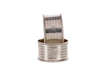 Lot 410 - A LOT OF FIVE SILVER NAPKIN RINGS