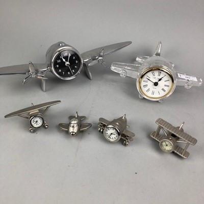 Lot 502 - A LOT OF SIX AEROPLANE FORM CLOCKS