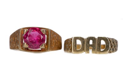 Lot 548 - A RED GEM SET RING AND A 'DAD' RING