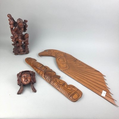Lot 105 - A CHINESE CARVED ROOTWOOD FIGURE GROUP AND THREE WALL MASKS