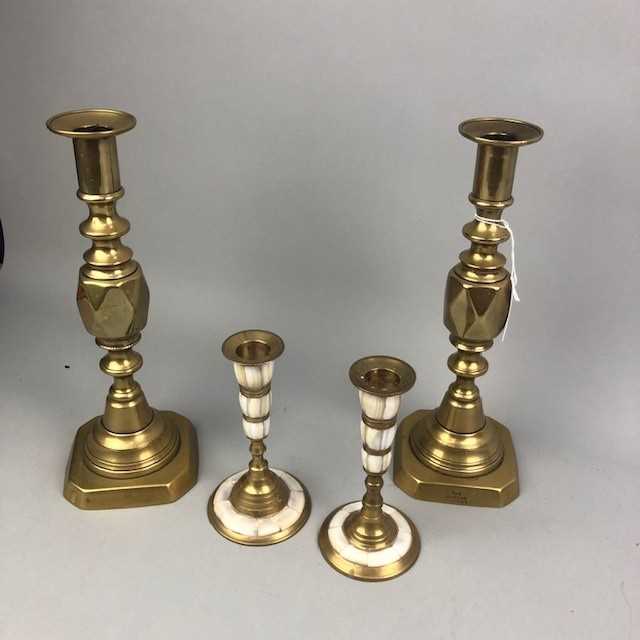 Lot 47 - A PAIR OF BRASS 'THE DIAMOND PRINCESS' CANDLESTICKS AND ANOTHER PAIR OF CANDLESTICKS