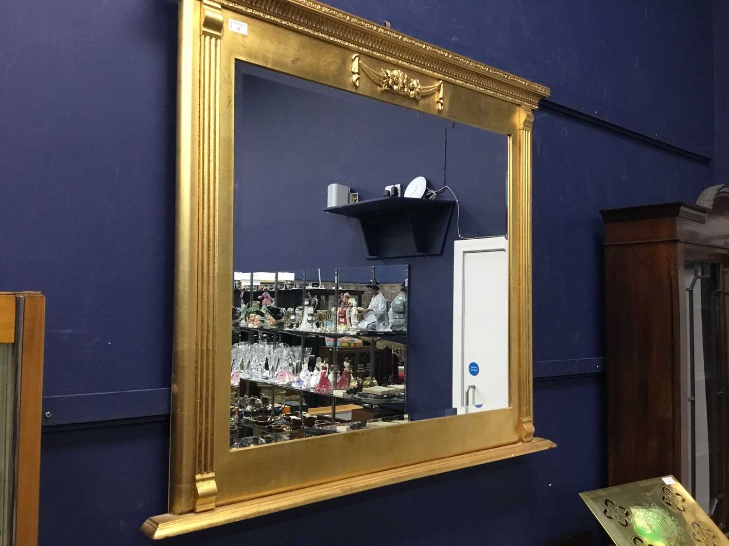 Lot 12 - A REPRODUCTION GILT FRAMED OVER MANTEL MIRROR
