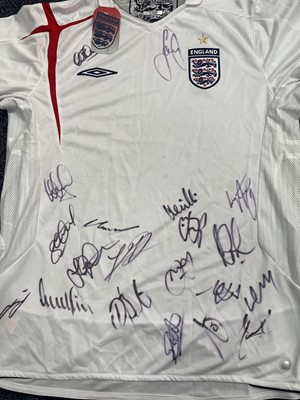Lot 1724 - AN ENGLAND INTERNATIONAL JERSEY SIGNED BY THE TEAM, ALONG WITH RELATED EPHEMERA