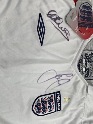 Lot 1724 - AN ENGLAND INTERNATIONAL JERSEY SIGNED BY THE TEAM, ALONG WITH RELATED EPHEMERA