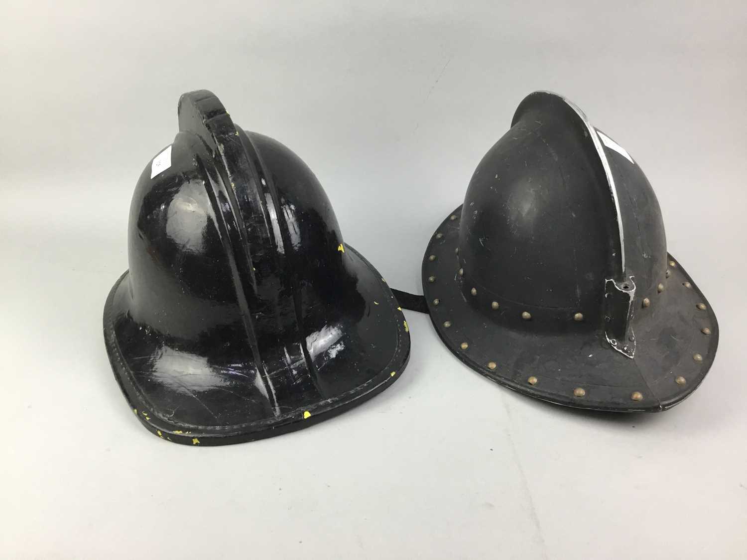 Lot 325 - A LOT OF TWO LACQUERED FIREMAN'S HELMETS