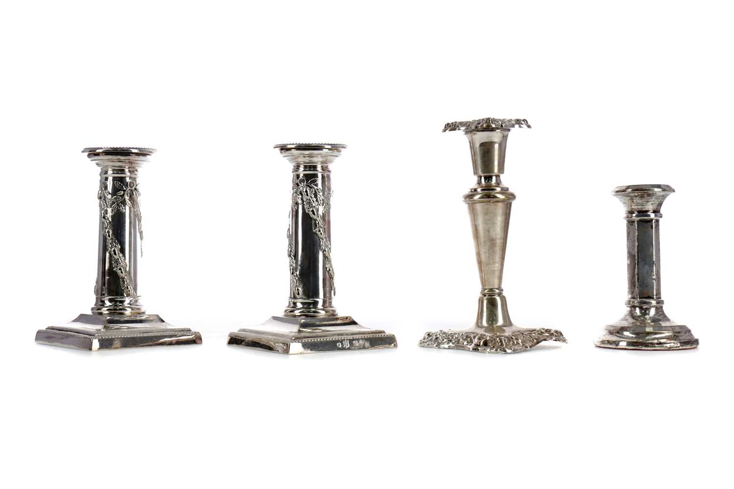 Lot 435 - AN EDWARDIAN SILVER CANDLESTICK AND THREE OTHERS