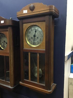 Lot 251 - AN EARLY 20TH CENTURY STAINED WOOD KITCHEN WALL CLOCK