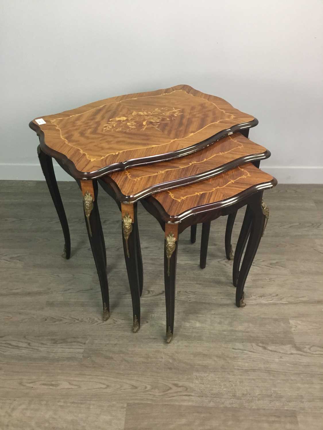 Lot 1340 - A NEST OF THREE FRENCH KINGWOOD AND MARQUETRY TABLES