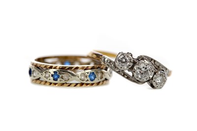 Lot 891 - A DIAMOND THREE STONE RING AND A BLUE AND WHITE GEM SET BAND