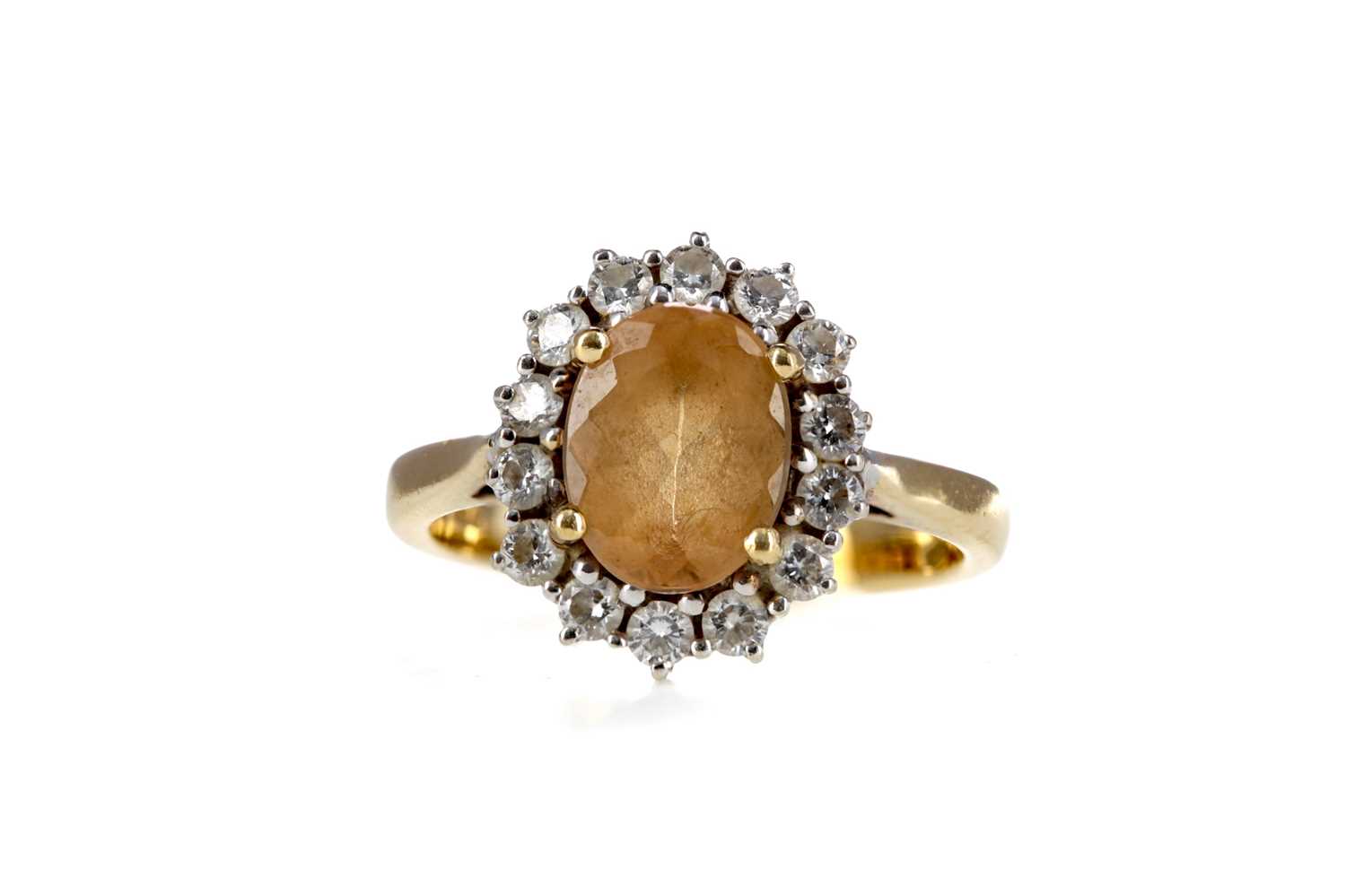 Lot 874 - AN IMPERIAL TOPAZ AND DIAMOND CLUSTER RING