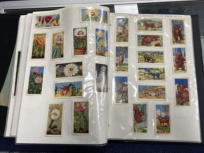 Lot 452 - A COLLECTION OF TRADE CARDS, STAMPS AND POSTCARDS