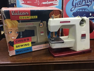 Lot 477 - A VINTAGE VULCAN COUNTESS CHILD'S SEWING MACHINE AND TWO PRINTED PANELS