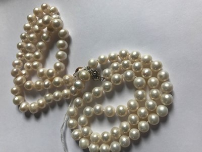 Lot 1557 - TWO STRINGS OF PEARLS