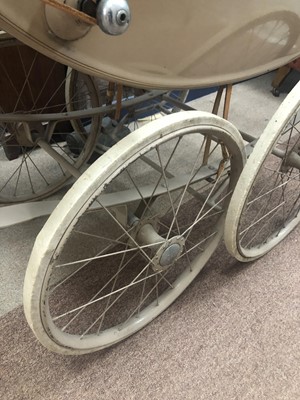 Lot 502 - A VINTAGE SILVER CROSS PRAM