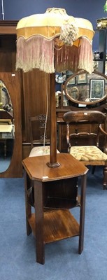 Lot 514 - AN ART DECO MAHOGANY COMBINATION LAMP AND BOOK TABLE