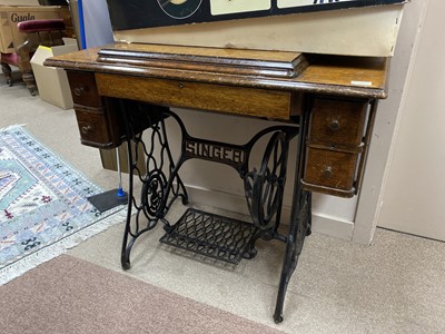 Lot 494 - AN OAK TREADLE SEWING MACHINE
