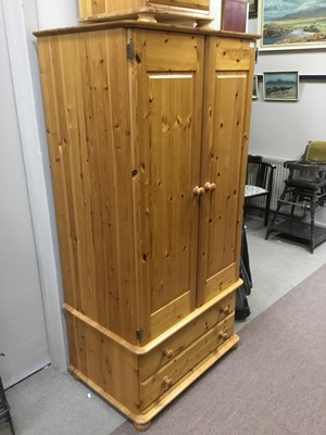 Lot 501 - A PINE EFFECT WARDROBE AND TWO BEDSIDE CHESTS