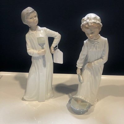 Lot 573 - A PAIR OF NAO 'READY FOR BED' FIGURES
