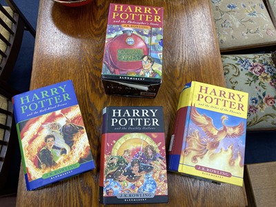 Lot 586 - A LOT OF THREE HARRY POTTER BOOKS AND A BOXED SET OF FOUR PAPERBACKS
