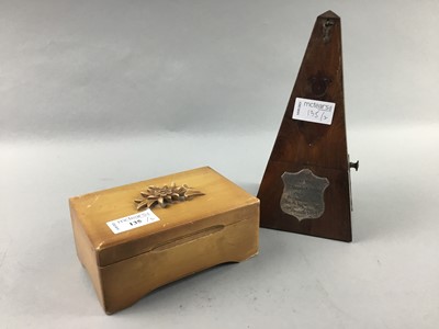 Lot 135 - A SMALL MUSICAL TRINKET BOX AND A METRONOME