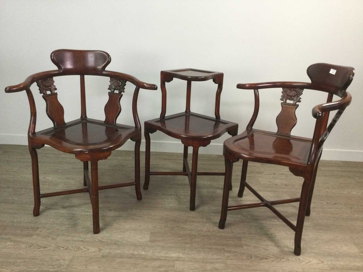 Lot 125 - A PAIR OF CHINESE HARDWOOD CORNER CHAIRS AND A TWO TIER TABLE