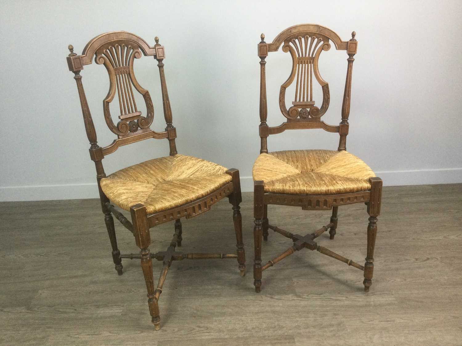 Lot 1406 - A PAIR OF FRENCH WALNUT LYRE BACK SINGLE CHAIRS